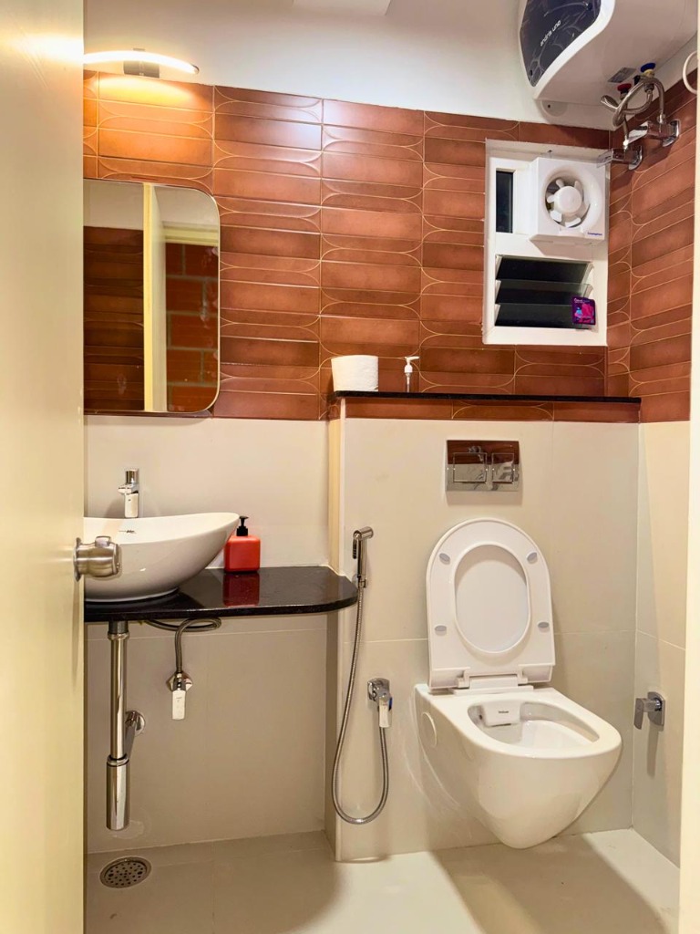 Luxury Restroom with Orange Tiles