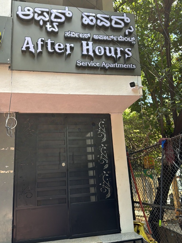 After Hours Service Apartments Entrance Sign